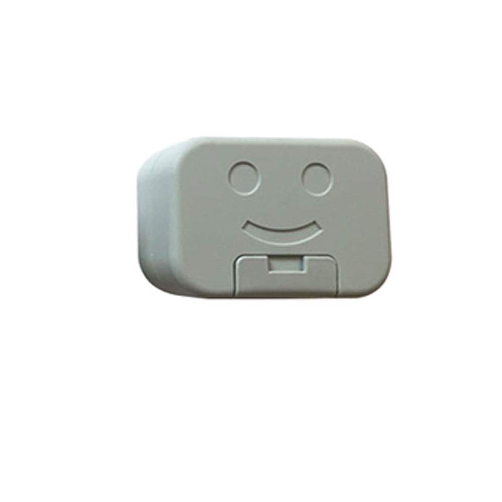Boîte à savon de voyage bleue à motif smiley, ouverte autour d’un savon solide