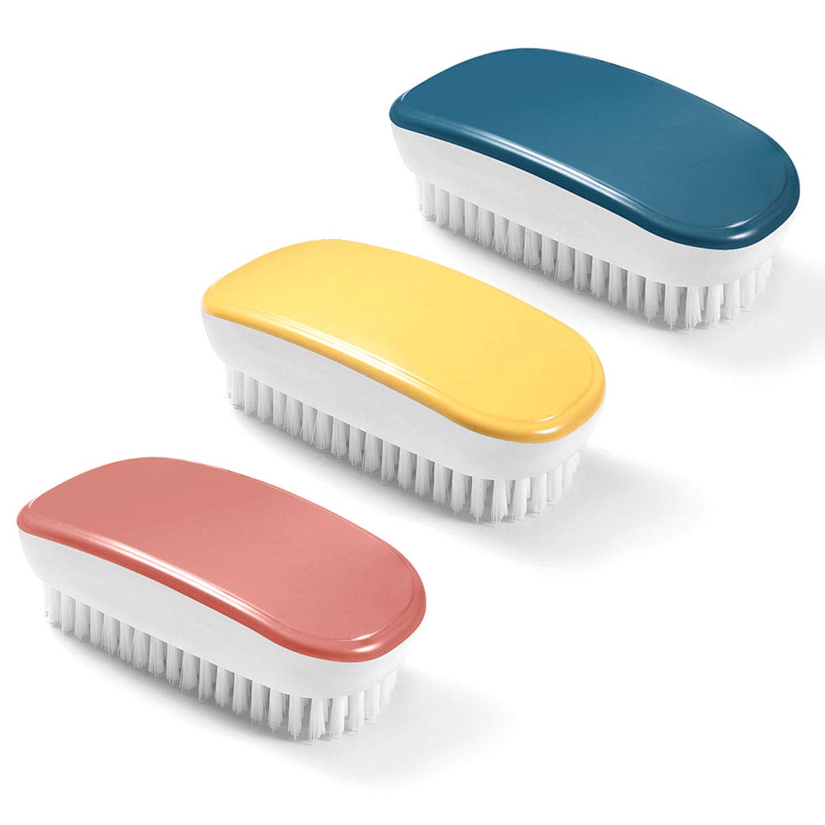 Trois brosses à linge compactes à poignée intégrée et poils PBT posées sur du lin écru.