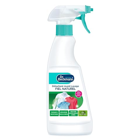 Flacon spray détachant au fiel de bœuf posé sur du lin écru dans une buanderie lumineuse