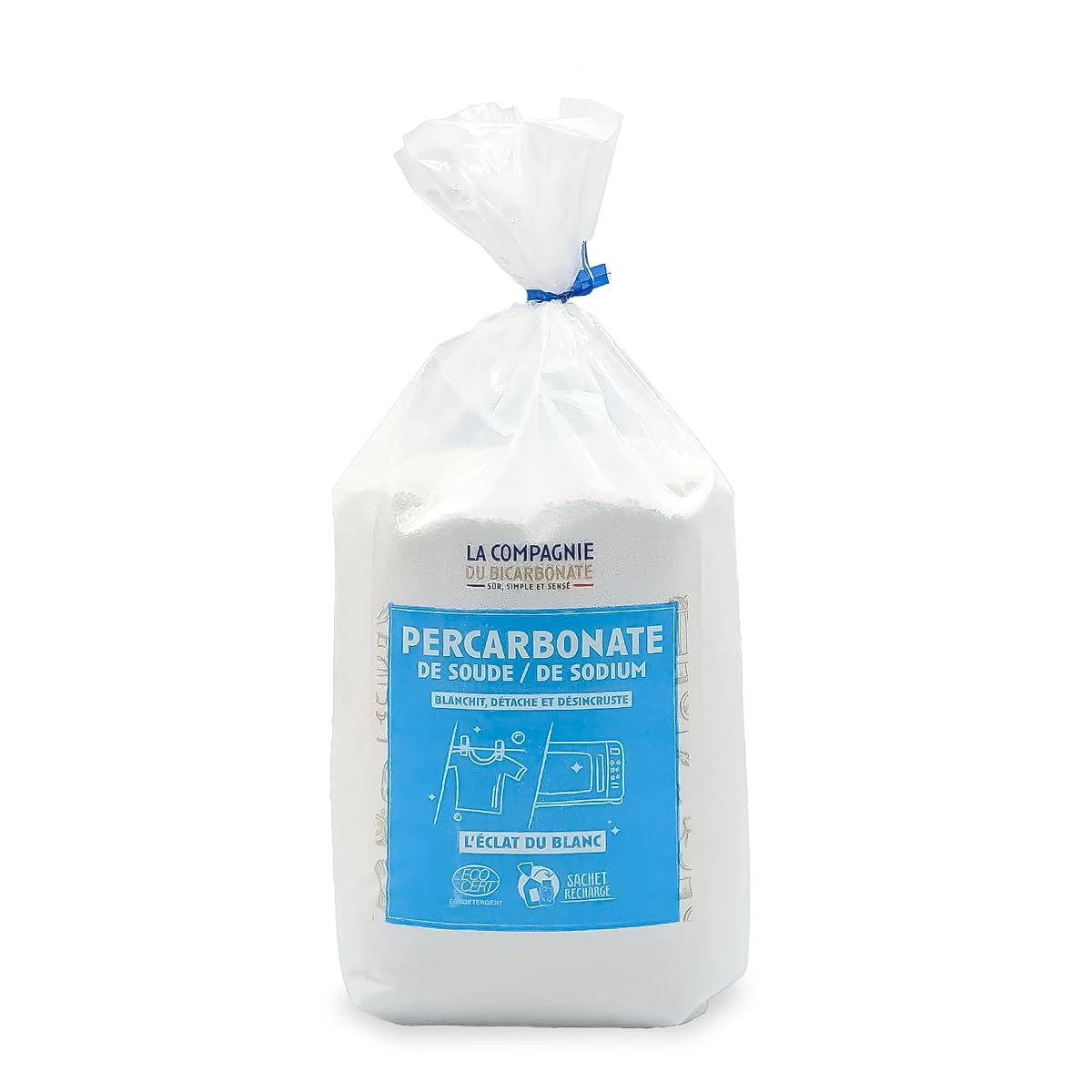 Poudre blanche de percarbonate de soude dans une coupelle en céramique sur du lin écru