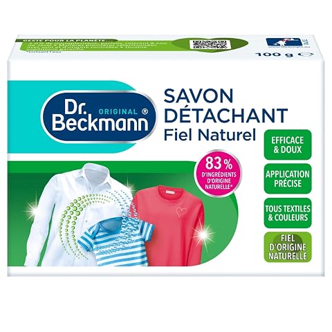 Trois pains de savon détachant au fiel de bœuf posés sur du lin écru dans une buanderie